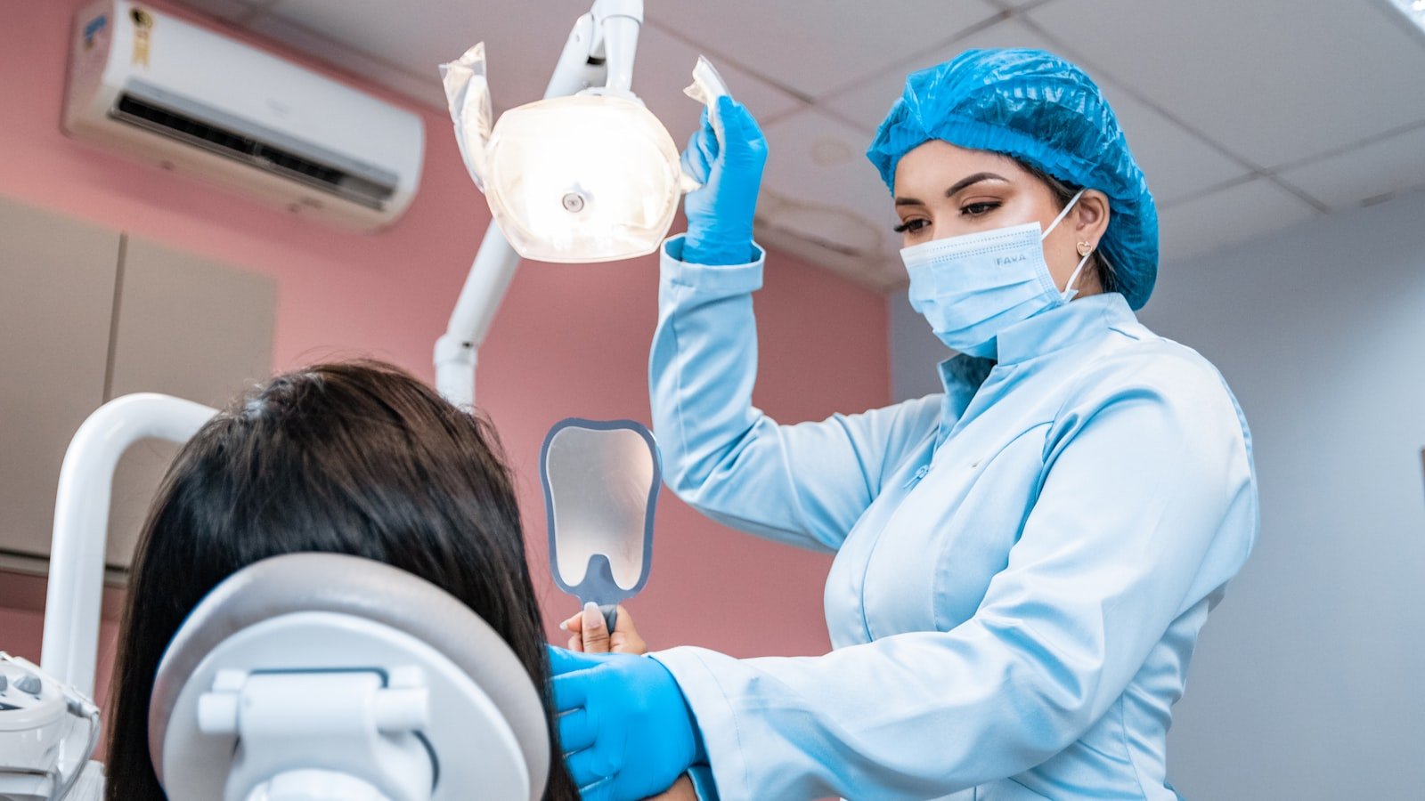 Dental clinic front desk scheduling the next appointment for a returning patient